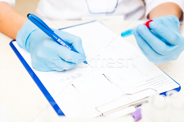 Scientist working with samples Stock photo © luckyraccoon