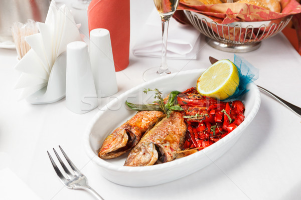 Fried fish with red peppers and lemon. Stock photo © luckyraccoon