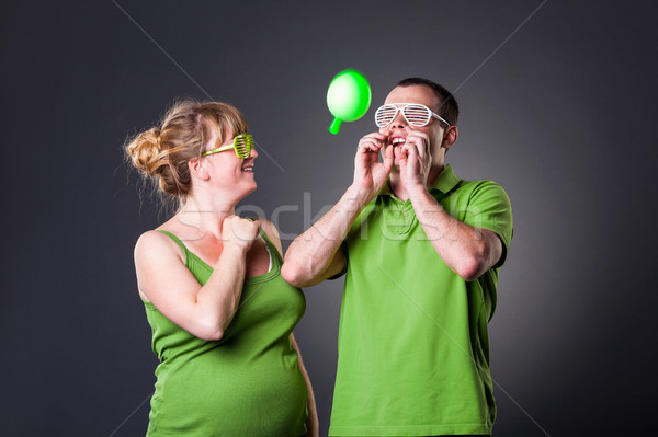 Happy young couple having fun with balloons Stock photo © luckyraccoon