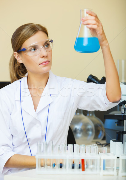 Young beautiful scientist working with samples in lab. Stock photo © luckyraccoon