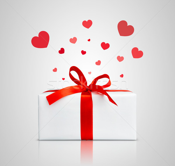 Stock photo: Present box with red ribbon. 