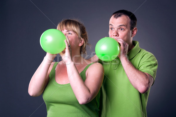 Happy young couple having fun with balloons Stock photo © luckyraccoon