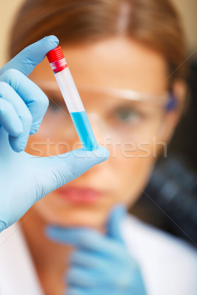 Young scientist working with samples in lab. Stock photo © luckyraccoon