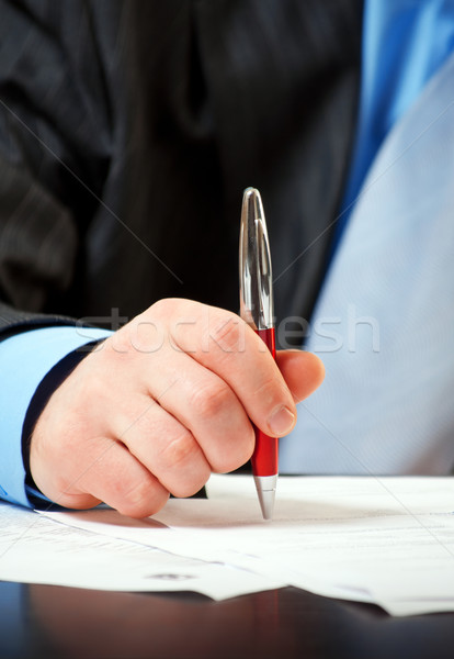 businessman with pen signing contract  Stock photo © luckyraccoon