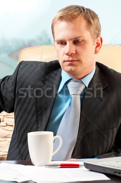 portrait of a young businessman in doubt about something Stock photo © luckyraccoon