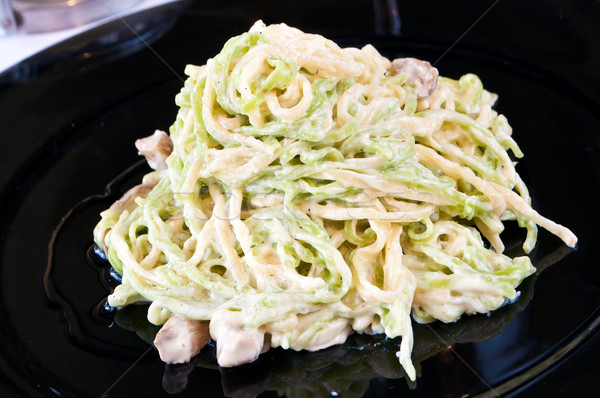 closeup of Green and yellow taliolini with porcini mushrooms     Stock photo © luckyraccoon