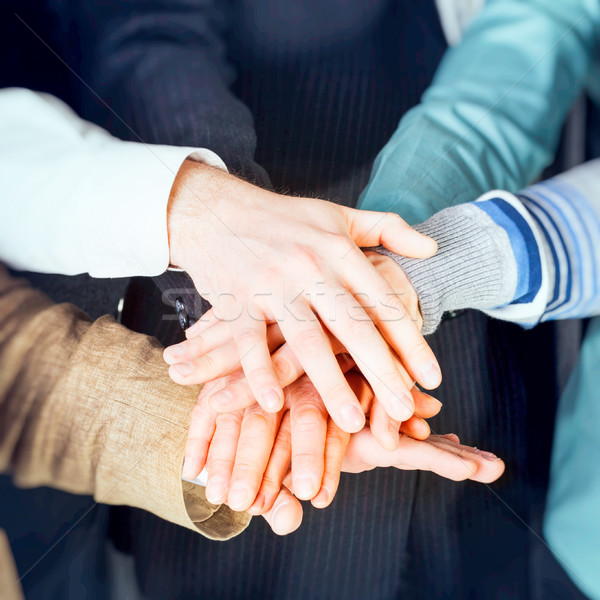 Stock photo: Group of business people with hands together