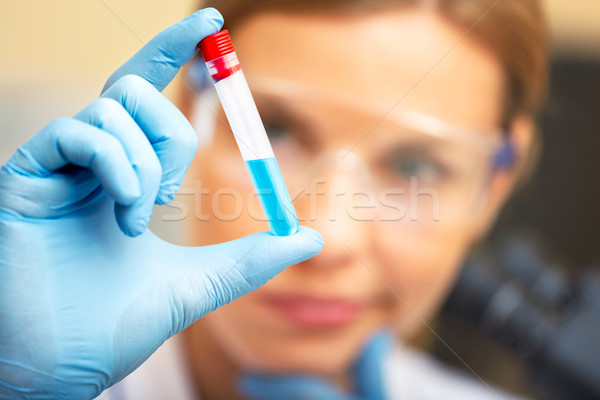 Young scientist working with samples in lab. Stock photo © luckyraccoon