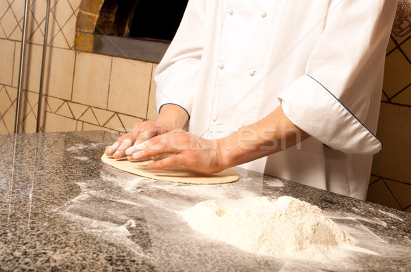 Chef making a Pizza Base Stock photo © luckyraccoon