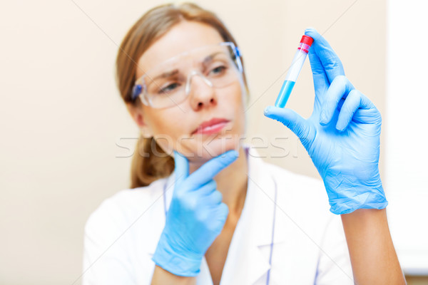 Young scientist working with samples in lab. Stock photo © luckyraccoon