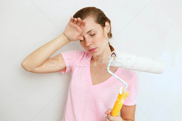 Woman resting painting the wall. Stock photo © luckyraccoon