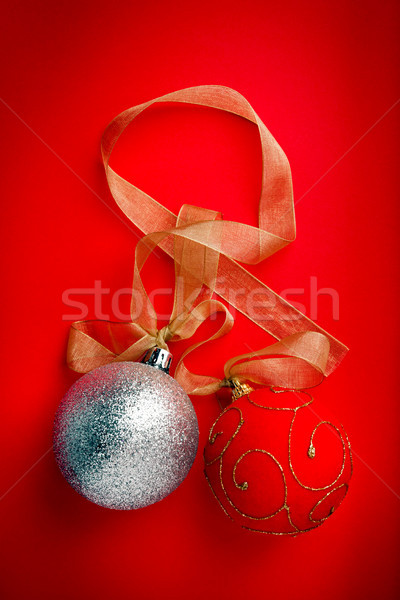 Christmas balls on red background Stock photo © luckyraccoon