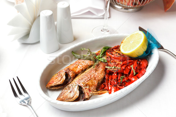 Fried fish with red peppers and lemon. Stock photo © luckyraccoon