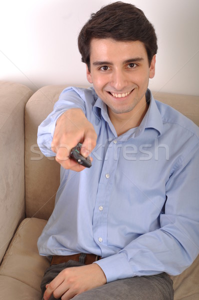 Smiling man watching tv Stock photo © luissantos84