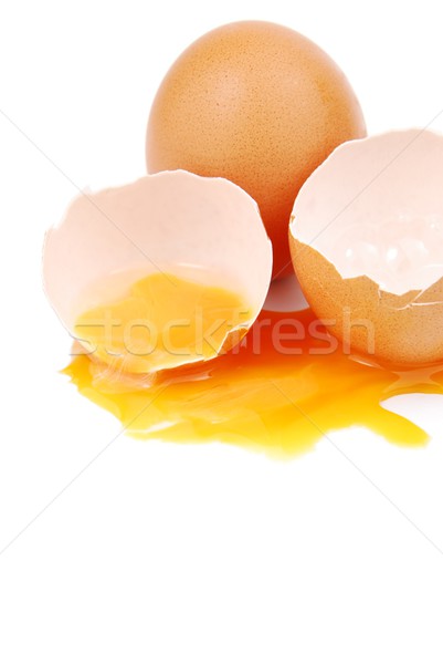 Broken egg with the yolk and white oozing out Stock photo © luissantos84