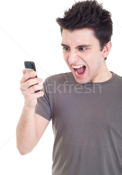 Stock photo: Man yelling into mobile