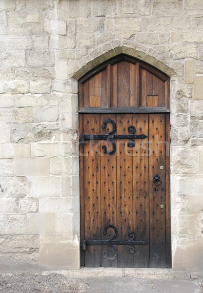 Fából készült ajtó középkori éra öreg kőfal Stock fotó © luissantos84