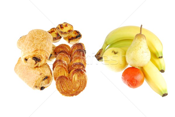 Healthy vs unhealthy (baked goods and fruits on white) Stock photo © luissantos84