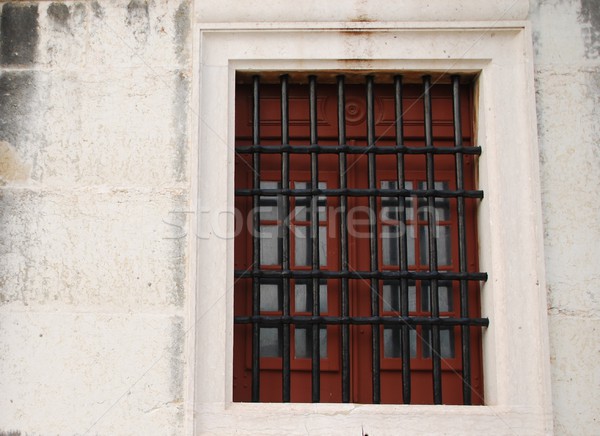 Window with bars of a medieval building Stock photo © luissantos84