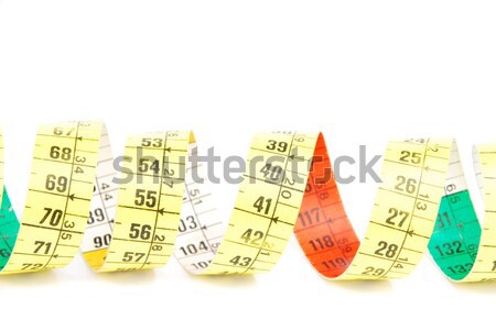 Close-up of a curled measuring tape on white Stock photo © luissantos84
