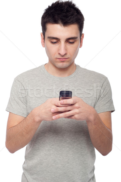 Lezser férfi sms üzenetküldés fiatal küldés szöveges üzenet Stock fotó © luissantos84