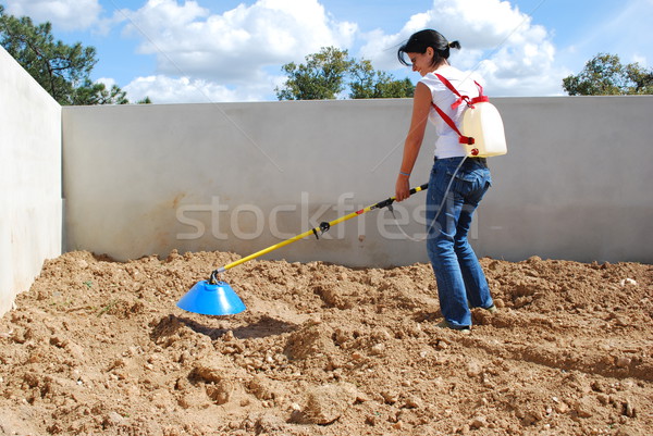 Young farmer fertilizing the soil Stock photo © luissantos84