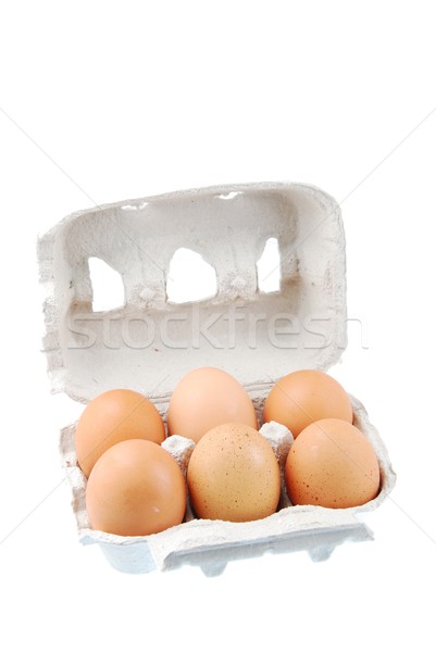 Six brown eggs packed in a carton box Stock photo © luissantos84