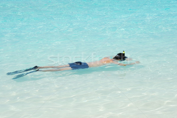 Young man snorkeling in Maldives (blue ocean water) Stock photo © luissantos84