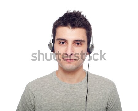 Foto stock: Casual · hombre · escuchar · música · joven · auriculares