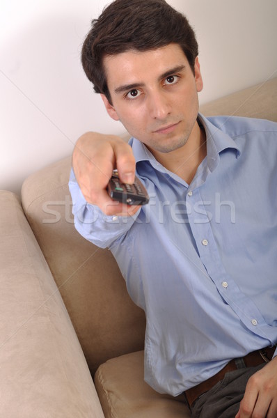 Smiling man watching tv Stock photo © luissantos84