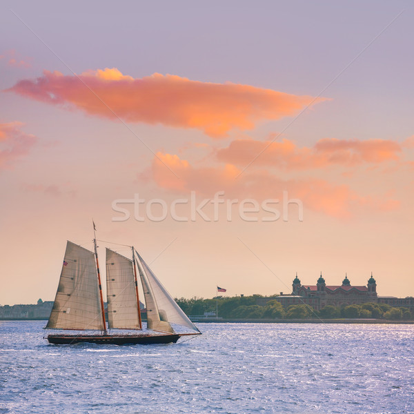 Stock photo: New York sailboat sunset and Ellis Island