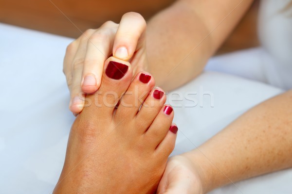Reflexology woman feet massage therapy Stock photo © lunamarina