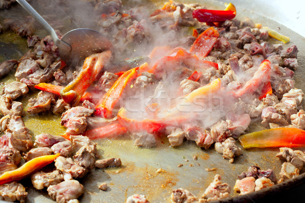 Paella from Spain first steps cooking big pan Stock photo © lunamarina