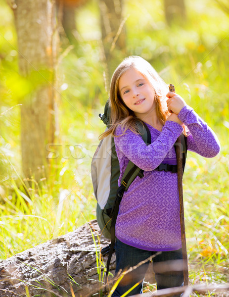 Hiking kid girl with backpack in autum poplar forest Stock photo © lunamarina
