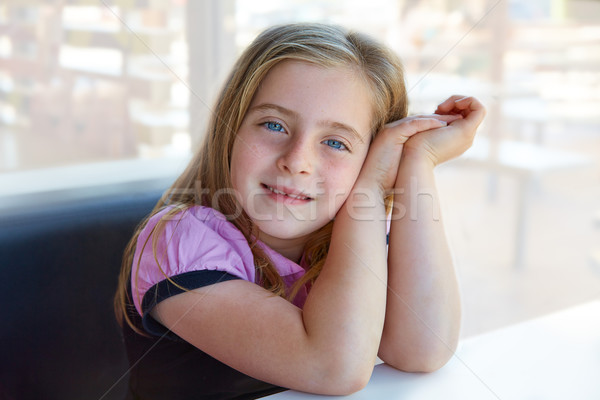 Blond Relaxed Happy Kid Girl Expression Blue Eyes Stock Photo