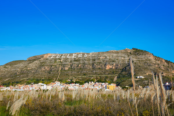 Cullera mountain with white sign writted on in Stock photo © lunamarina