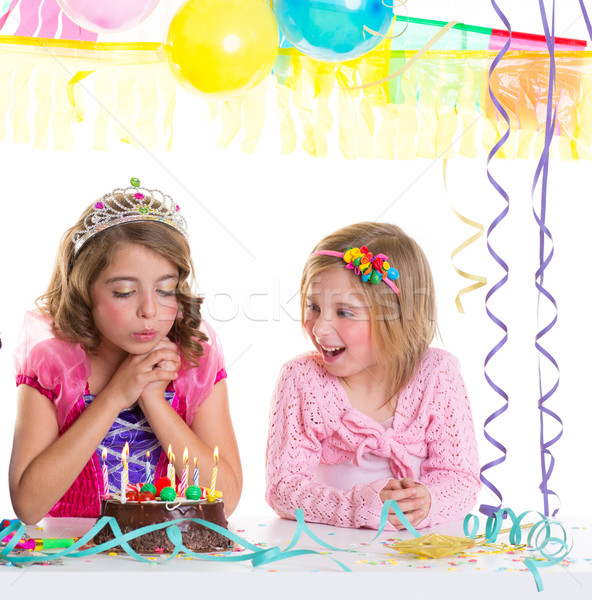 children happy girls blowing birthday party cake Stock photo © lunamarina