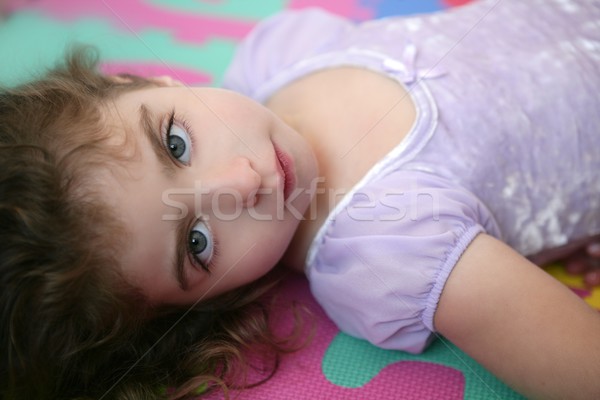 Beautiful blue eyes little girl lying on floor Stock photo © lunamarina