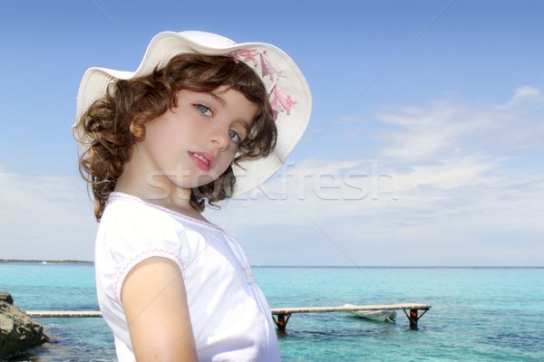 tourist little girl hat formentera turquoise sea Stock photo © lunamarina