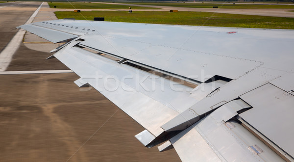 aircraft plane wing taking off on airport Stock photo © lunamarina