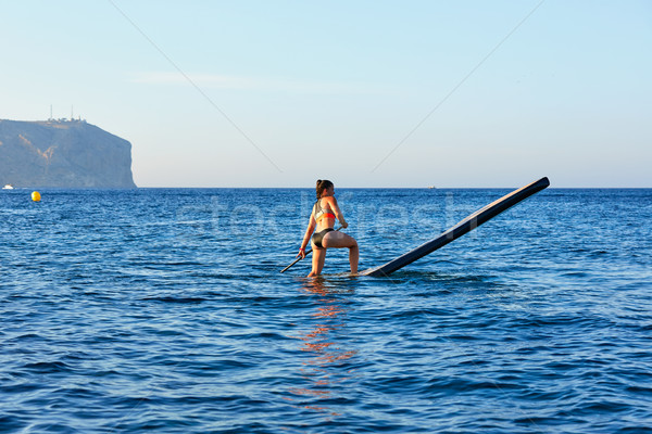 Stand up surf ragazza blu Ocean Foto d'archivio © lunamarina