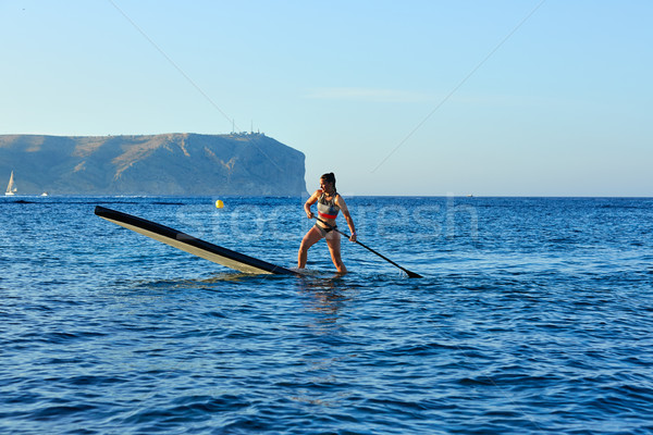 Stand up surf ragazza blu Ocean Foto d'archivio © lunamarina