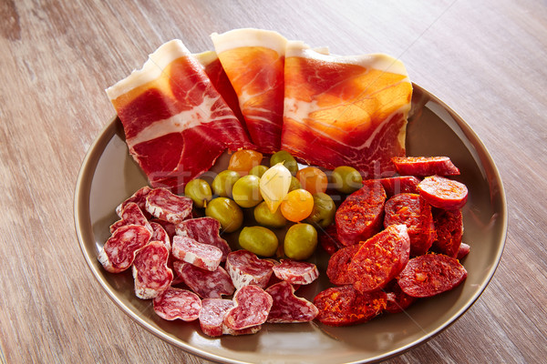 Stock photo: Tapas of Spain with ham olives sausage chorizo