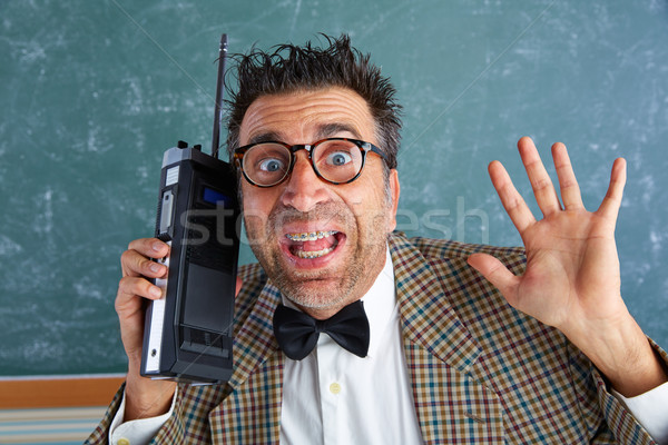 Nerd silly private investigator retro walkie talkie Stock photo © lunamarina