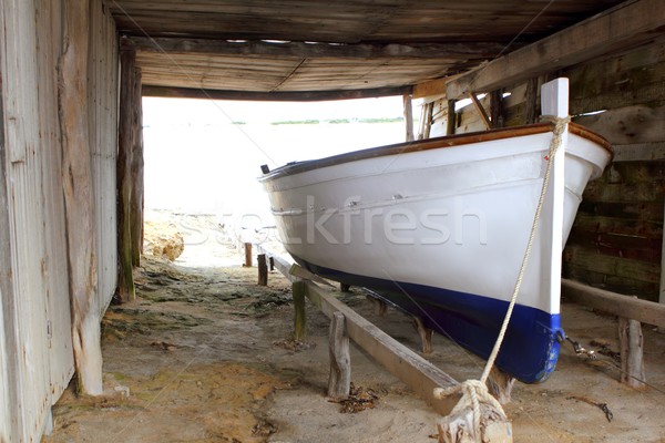 Formentera boat stranded on wooden rails Stock photo © lunamarina