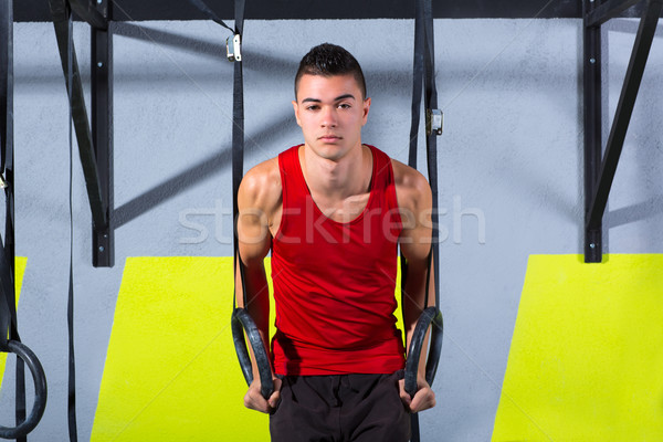 Crossfit dip ring young man workout at gym dipping Stock photo © lunamarina