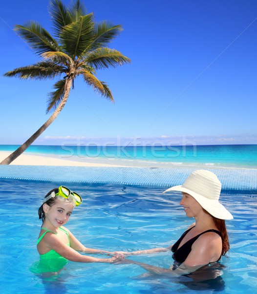 Stock photo: daughter and mother in swimming pool tropical