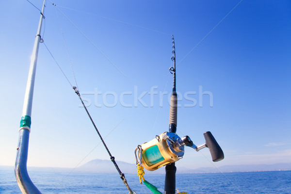 fishing boat trolling with outrigger gear Stock photo © lunamarina