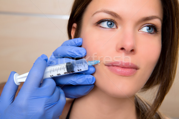 Anti aging facial mesotherapy with syringe closeup woman face Stock photo © lunamarina
