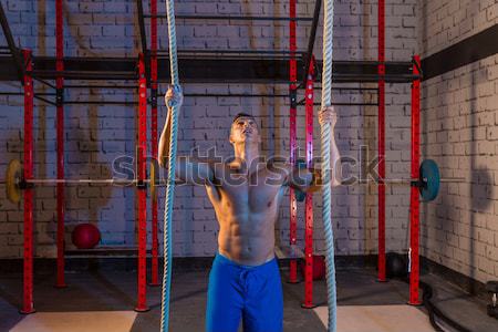 Toes to bar man pull-ups 2 bars workout Stock photo © lunamarina